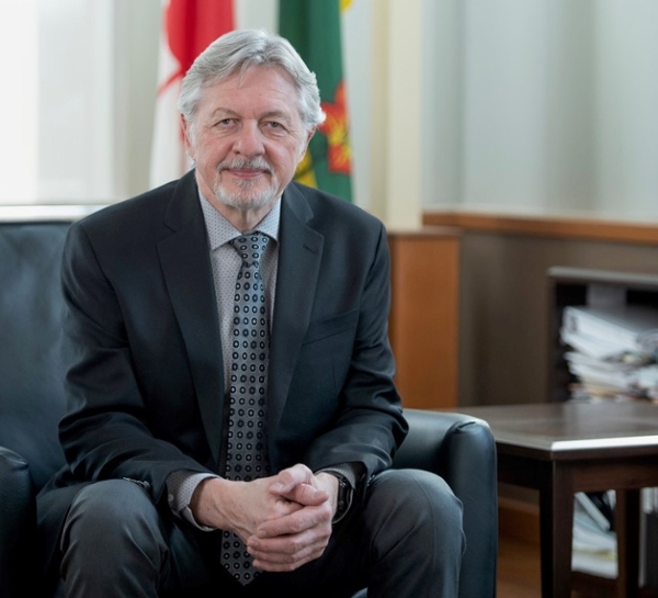 Photo of Chief Justice Popescul seated in his office