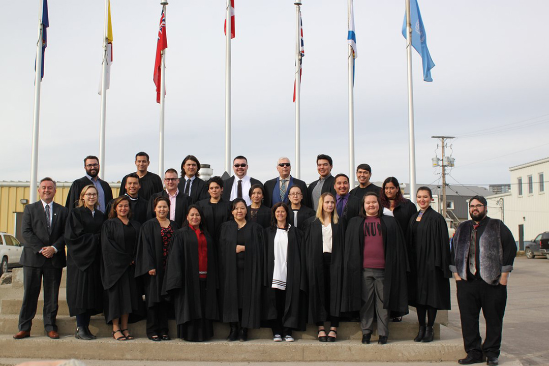 Students at the First Year Welcoming Ceremony with Program Director Stephen Mansell (far right) and College of Law Dean Martin Phillipson (far left).