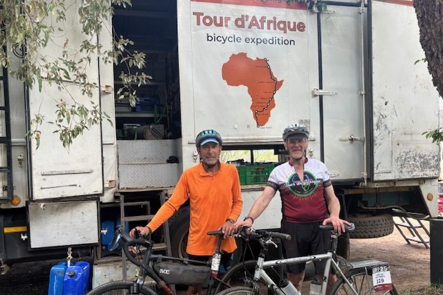 Don Layh and Don Buckingham pose for a photo with their bicycles in Africa
