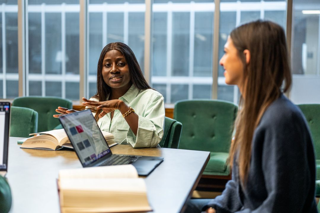 Photo of two women studying
